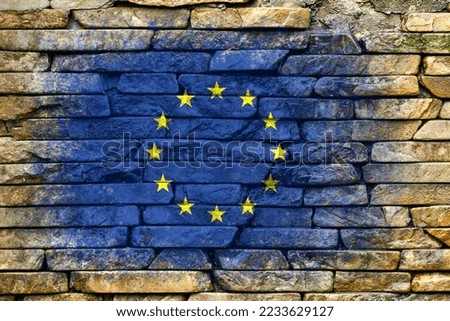 Flag of European Union. Flag is painted on a stone wall. Stone background. Textured creative background