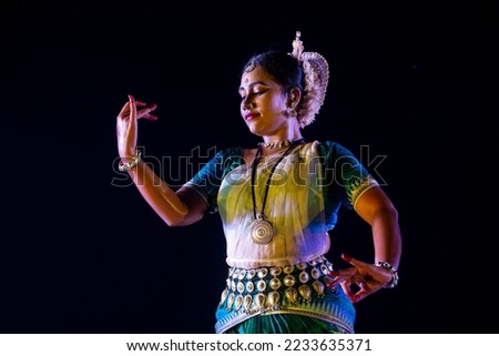 Odissi Dancer wears traditional costume posing at stage, Bhubaneswar, Odisha, India