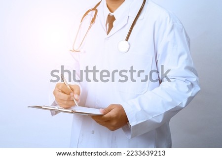Doctor holding a clipboard on white background