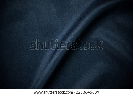 Dark Luxury smooth clothes texture, pattern, elegant navy blue of silk fabric texture as background Abstract background picture.