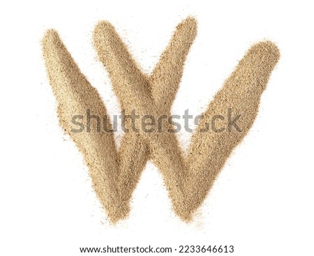 Sand alphabet letter W, isolated on white, clipping path
