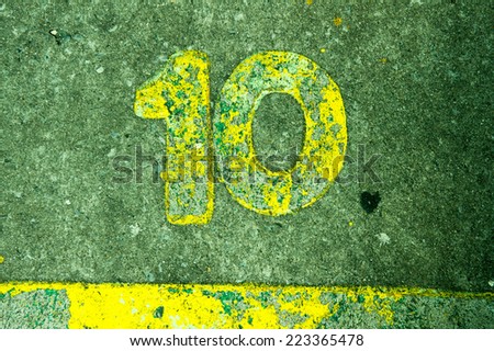 Number 10 on the concrete floor