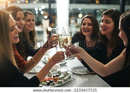 Sushi, friends and restaurant cheers with champagne for birthday celebration or social event. Celebrate toast, happy and smile of women with japanese food eating and drinking together with alcohol