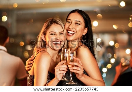 Portrait, champagne and clubbing with woman friends drinking alcohol in celebration of the new year. Party, diversity and event with a female and friend enjoying a drink together at a luxury social Royalty-Free Stock Photo #2233657745