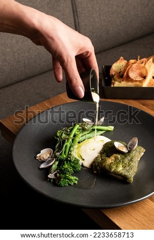 food elegant expensive dish plate dark black gourmet dinner chef Royalty-Free Stock Photo #2233658713