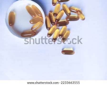 Close up of capsules Omega 3 or Fish Oil or Cod liver oil. Gel capsules on Isolated white background. Health care concept
