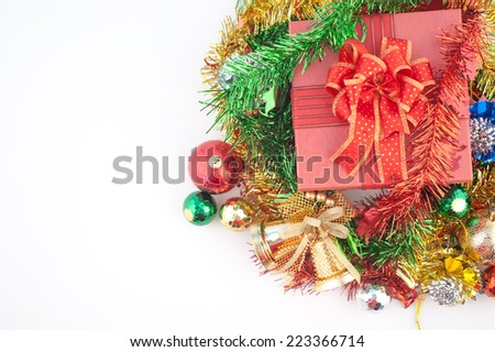 Christmas gift box with decorations and color ball isolated on white background