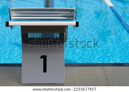 Starting platforms with number 1 for swimming races and competitions. Swimming pool starting block Royalty-Free Stock Photo #2233677457