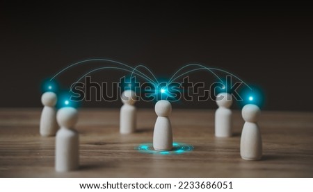 Business and communication technology concept. Chain of people figurines connected. Cooperation and interaction between people and employees. Dissemination of information in HR  society. Royalty-Free Stock Photo #2233686051