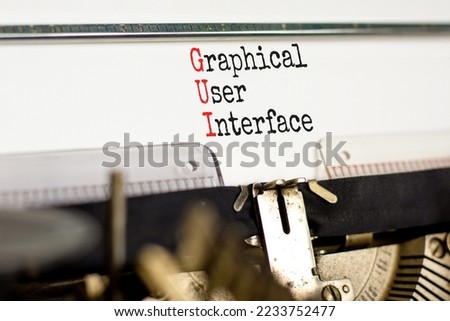 GUI graphical user interface symbol. Concept words GUI graphical user interface typed on old retro typewriter. White background. Business and GUI graphical user interface concept. Copy space.