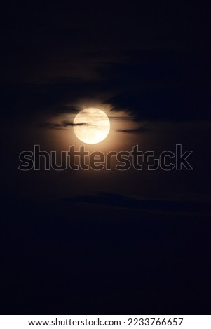 selective focus picture of full moon and clouds