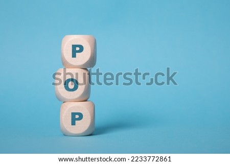POP, point of presence acronym letters on wooden blocks isolated on light blue background copy space
