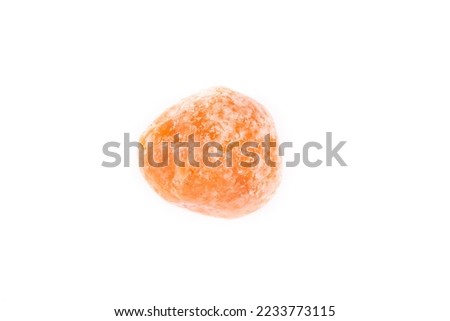 Dried tangerine on a white background, close-up
