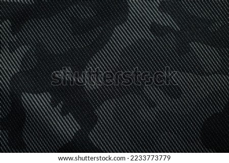 Camouflage pattern. Trendy dark gray camouflage fabric. Military texture. Dark background. Royalty-Free Stock Photo #2233773779
