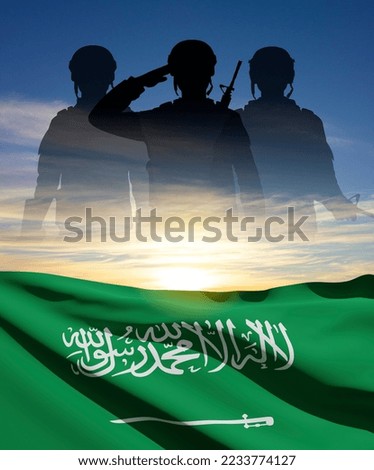 Silhouette of soldiers on background fo susnet and Saudi Arabia flag. Concept for National Holidays