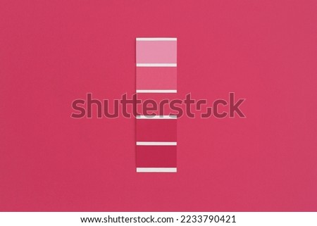 Color swatch with color of the year 2023 - Viva Magenta. Color trend palette. Top view, flat lay. Royalty-Free Stock Photo #2233790421
