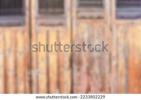 blurred brown old door background use as backdrop