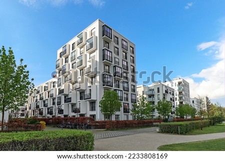 Cityscape of a residential area with modern apartment buildings, new green urban landscape in the city Royalty-Free Stock Photo #2233808169