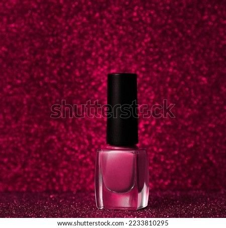 Nail polish in trendy color o sparkling background