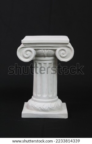 Various Greek Sourced Artworks displaying the famous ionic style columns as well as the Parthenon as a tealight holder.   Royalty-Free Stock Photo #2233814339