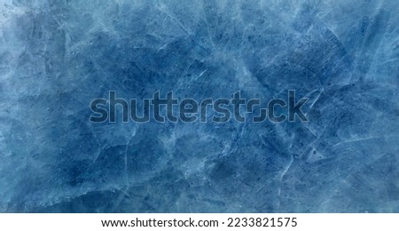 ice winter cracks grunge texture, soft blur ice skate blue background 