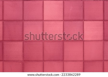 Color of year 2023 Viva Magenta. Image with aged square tiles are toned in pantone color of viva magenta. New Fashion colour. Clay Tile Flooring texture. Red stone clay quarry tiled floor detail