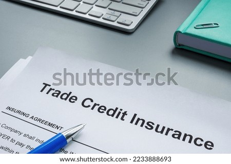 A Trade credit insurance application form for signing.