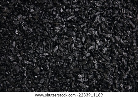Fuel for furnace heating - hard coal. Pile of natural black hard coal for texture background. Best grade of metallurgical anthracite coals often referred to as stone coal and black diamond coal. Royalty-Free Stock Photo #2233911189