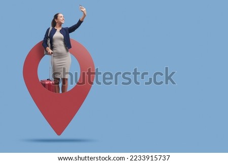 Traveling businesswoman woman in a GPS pin, she is taking a selfie with her smartphone