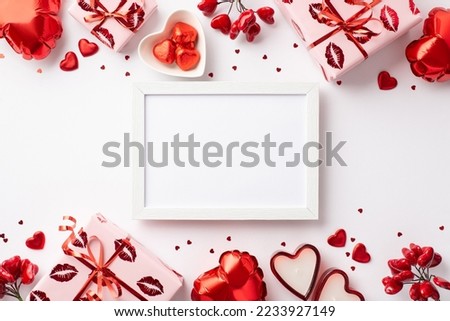 Valentine's Day concept. Top view photo of photo frame gift boxes heart shaped balloons candles saucer with candies and confetti on isolated white background with empty space