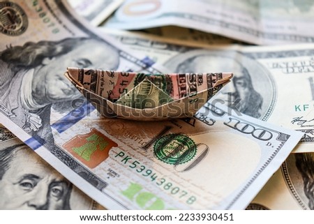 Dollar bills laid out on the table. Ship from dollar, financial crisis, money, finance, savings, bank. Photo, macro photography