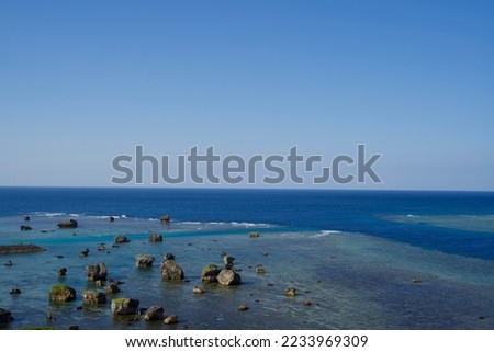 Seascape with rocky cove and horizon