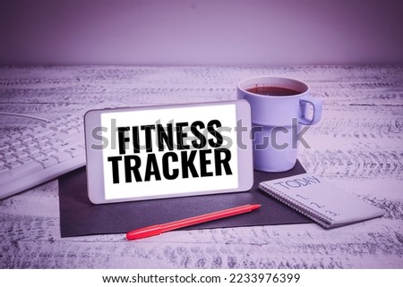 Hand writing sign Fitness Tracker. Word Written on device that records a persons daily physical activity