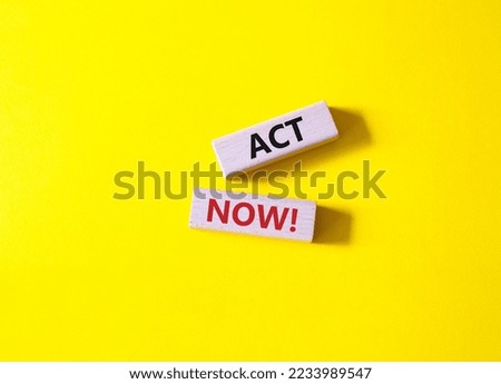 Act now symbol. Wooden blocks with words Act now. Beautiful yellow background. Business and Act now concept. Copy space.