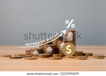 Stacked of Coins on table with percentage icon and Gray Background With Illustration Shows Increasing of Interest Rates, Financial Concept.	
