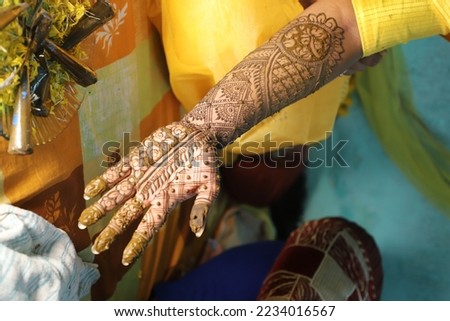 Mehndi is a form of body art and temporary skin decoration from the Indian subcontinent usually drawn on hands or legs. They are decorative designs that are created on a person's body, using a paste, 