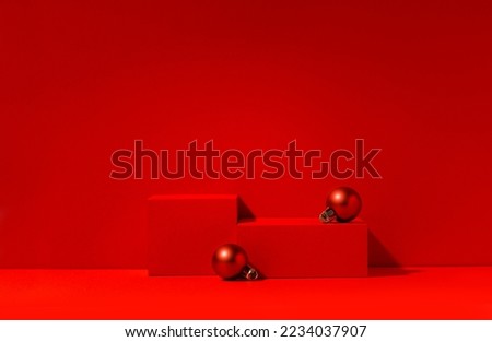 Red Christmas stage for product presentation, red podium with copy space. Studio photography.