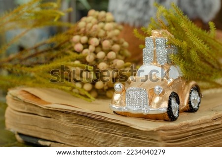 christmas decorations, golden car with a gift on the roof