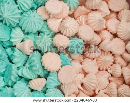 bunch of pink and light blue meringues for cake and sweets decoration footage