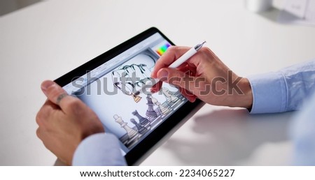 Graphic Photo Designer Using Tablet Computer Screen For Drawing