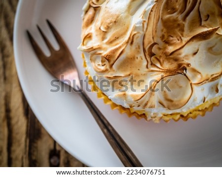  Lemon tart on wooden table 