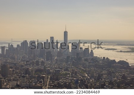 Beautiful view of skyscrapers of densely built-up Manhattan against smoke sky. New York. USA. 
