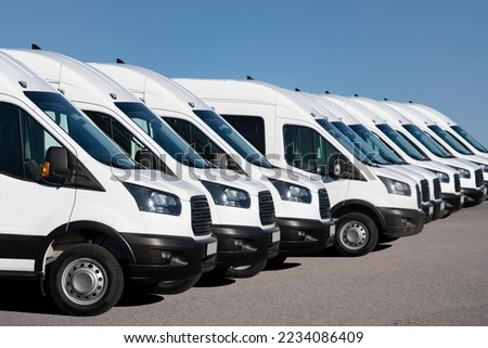 Delivery vans are parked in rows. Commercial fleet Royalty-Free Stock Photo #2234086409
