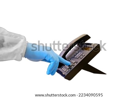 Doctor in medical uniform dials a phone numberin the office, close-up of a medic hand, isolated on a white background