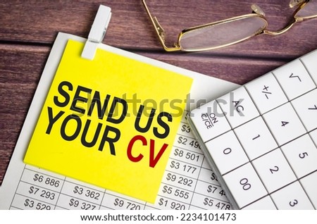 send us your cv Text on business paper on office table