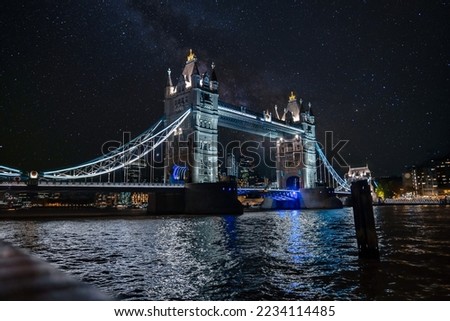 Iconic Tower Bridge connecting Londong with Southwark on the Thames River at night.