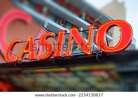 Casino neon sign. The inscription in beautiful red lights of the word - casino.