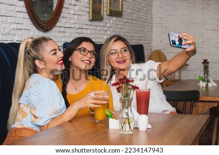 three female friends taking a selfie