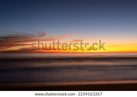 A Yellow sunset on the beach. seascape for background. colorful sky. beautiful water reflection. sunlight