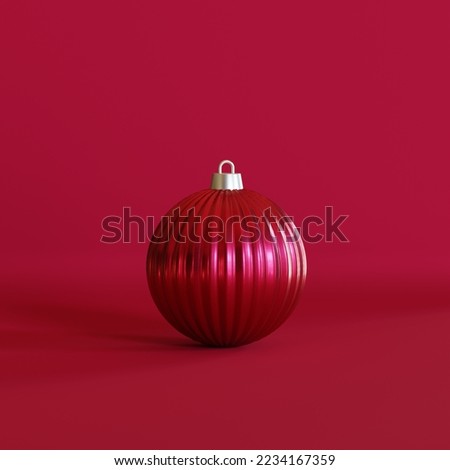 Viva magenta Christmas ball on color background. Christmas ornament on trendy Pantone’s colour of the year 2023